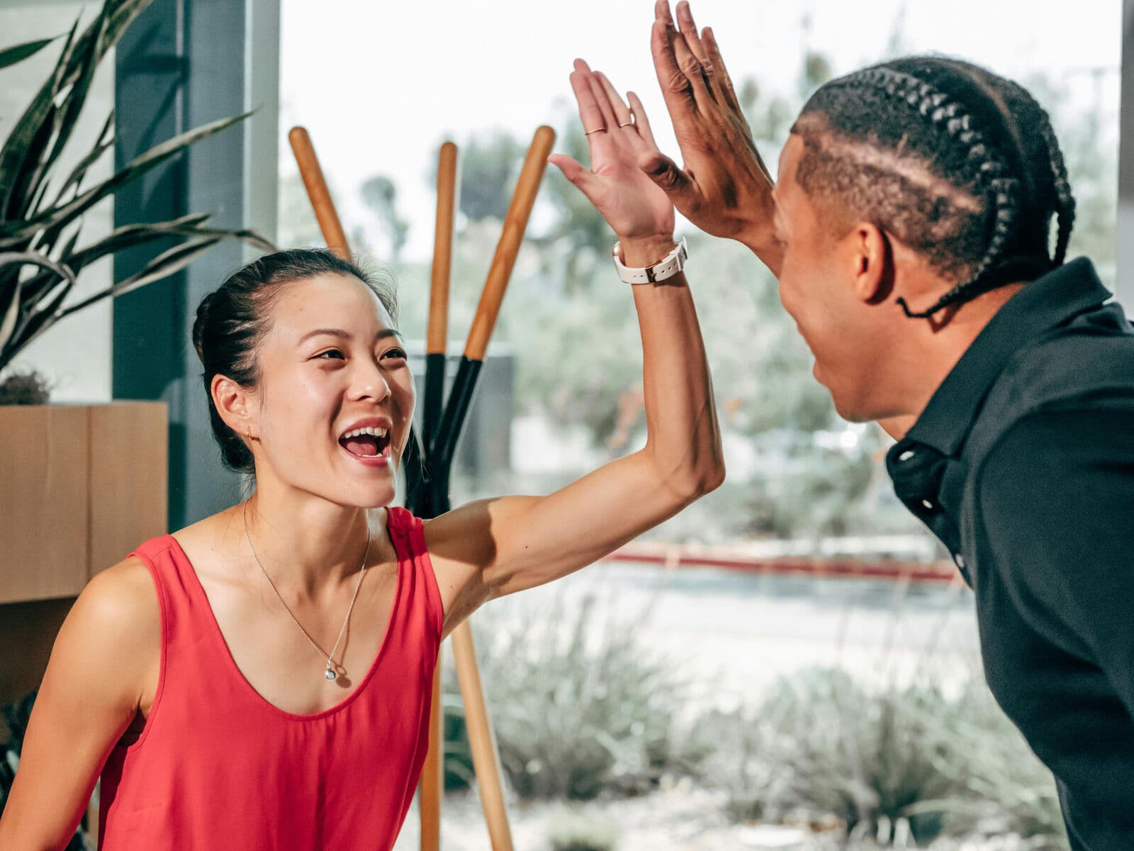 Two people celebrating with a high five
